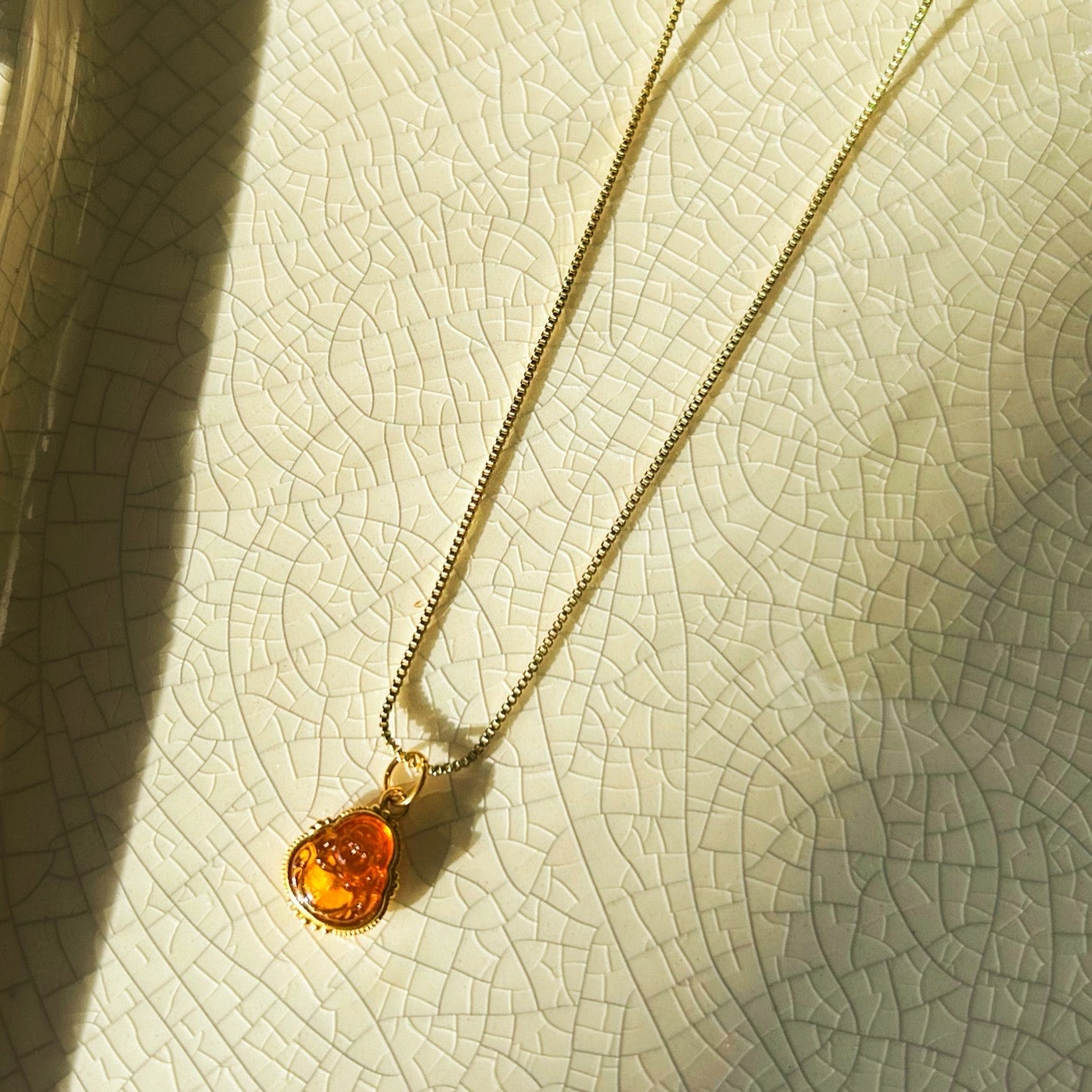 Amber Buddha Necklace